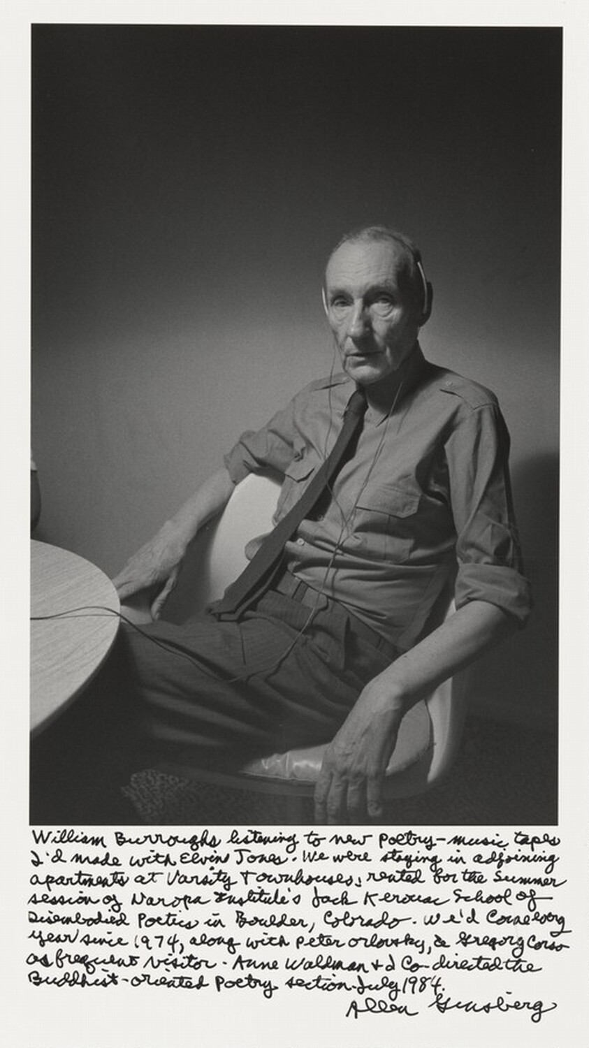 William Burroughs listening to new poetry-music tapes I'd made with Elvin Jones. We were staying in adjoining apartments at Varsity Townhouses, rented for the Summer session of Naropa Institute's Jack Kerouac School of Disembodied Poetics in Boulder, Colorado. We'd come every year since 1974, along with Peter Orlovsky, & Gregory Corso as frequent visitor. Anne Waldman & I co-directed the Buddhist-oriented poetry section. July 1984.