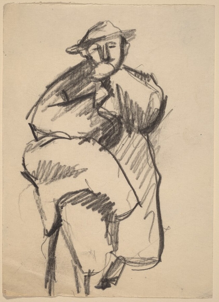 Seated Man Wearing Hat and Large Coat