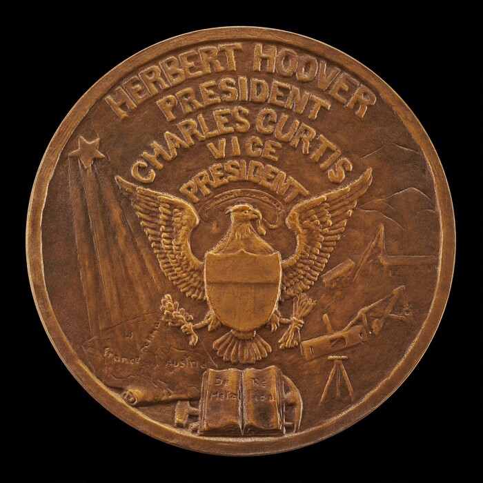 The sculpture depicts a circular bronze medal. In the center is an eagle with outstretched wings, holding arrows and an olive branch. Inscriptions above the eagle read "HERBERT HOOVER PRESIDENT" and "CHARLES CURTIS VICE PRESIDENT." Around the eagle are various embossed details, including a rising star, a globe with country names, and symbols of education and exploration like a telescope and an open book.