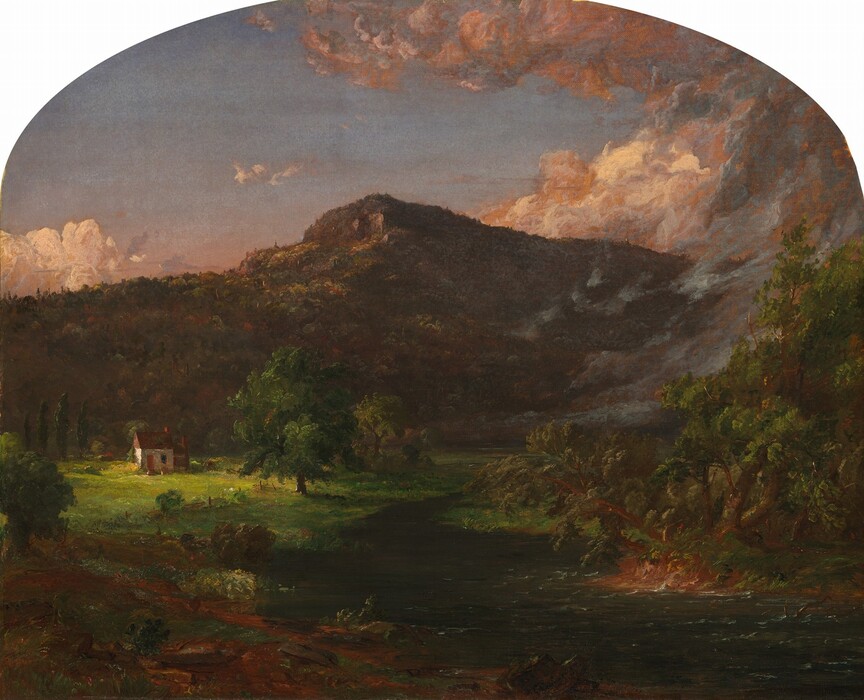 A river winds from close to us to a distant mountain outlined against a dim sky in this horizontal landscape painting, which has a shallowly arched top. The rippling river bends from the bottom right corner of the canvas into the middle of the painting and then curves out of view in a grassy field. Wisps of fog to the right show the distant path of the river. Land in the lower left corner of the painting is loosely painted with earthy green and brown, which could represent grass, rocks, and fallen tree trunks. Sunlight warms a single-story, compact, white-walled house with a brown roof and a chimney in a clearing to the left. A few trees stand near the house, and a tree-carpeted mountain rises sharply beyond it. The mountain is backlit or thrown into shadow by the low sun. In the top quarter of the composition, pale peach-colored clouds kick up around the mountain against a pink-tinged horizon in the blue sky. The artist signed and dated the painting as if he had written on a rock in the lower center of the composition, “1851 J.F. Cropsey.”