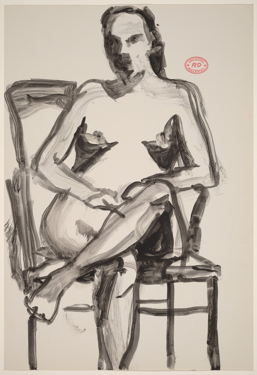 Untitled [nude seated in an armchair and crossing her legs]
