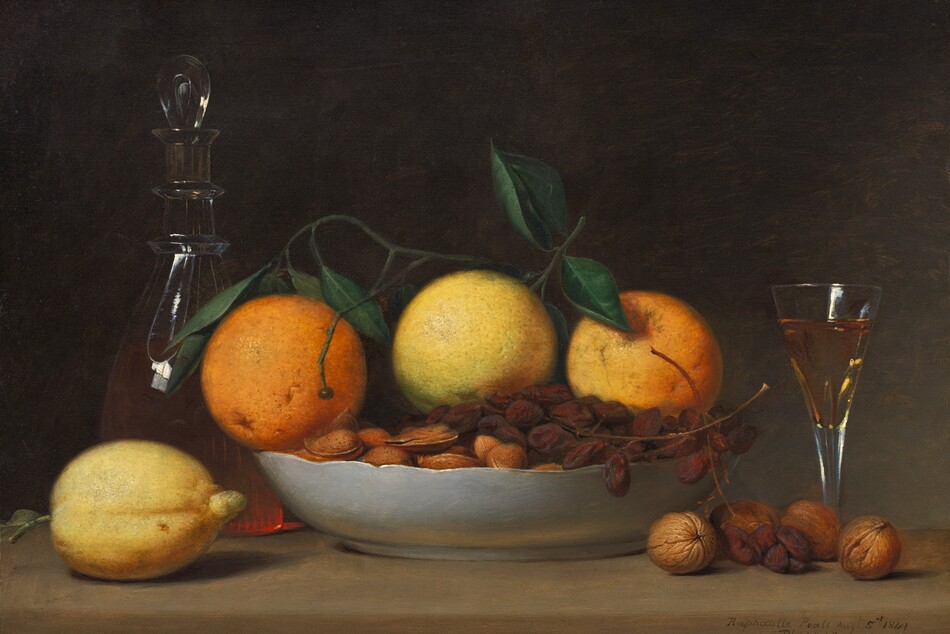 A shallow bowl filled with oranges, grapes, and nuts is surrounded by a short, flaring glass, a glass decanter, a lemon, and more nuts arranged along a wooden tabletop in this horizontal still life painting. The objects nearly fill the composition, and the table extends off both sides. The three oranges are pale, with the one at the center nearly yellow, and a stem of dark green leaves lies across the top. A bunch of shriveled grapes, like raisins still on the vine, lies across the almonds and other nuts, all in their shells, in the bowl. The outside of the bowl is white, and it has a gently scalloped rim. A lemon sits to our left of the bowl of fruit, and behind it, the glass decanter has a teardrop-shaped glass stopper. Light coming from the front and our left makes the peachy liquid glow. To our right are four whole walnuts in their shells, with a few grapes hanging from the bowl. Behind the walnuts, a long stemmed, flaring, clear glass is almost filled with the peach-colored liquid. The background is deeply shadowed at the upper left, lightening slightly to elephant gray toward the lower right. The artist inscribed the painting as if he had written his name, date, and location on the front edge of the table, near the lower right corner: “Raphaelle Peale Aug: 5th 1814 Philad:”