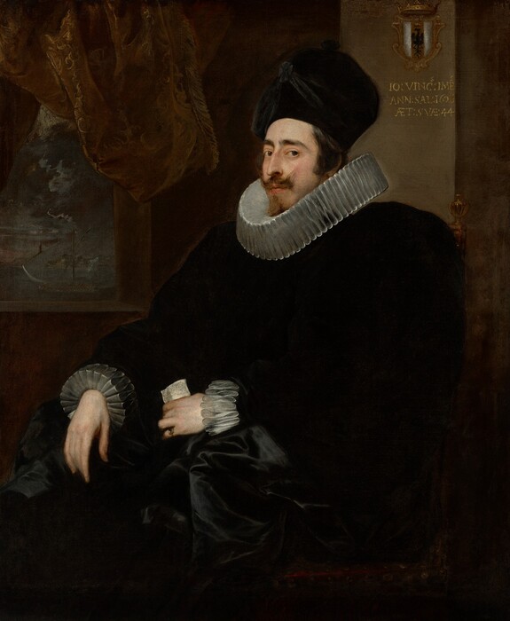 Shown from the knees up, a pale-skinned man wears a tall, black hat, wide white ruffs at the neck and cuffs, and a voluminous black garment in this vertical portrait painting. The dark costume nearly blends into the brown background in some places, so details are difficult to make out. The man sits in a chair so his body and knees are angled to our left. His face is also turned in that direction, but he looks at us from the corners of his brown eyes under dark, heavy brows. He has a thin face with a long, bumped nose. His brown mustache flicks up at the outer ends, and a thin line of hair down his chin creates his beard. His black hat has a high, rounded top and is draped with black fabric and a rosette. The ruffs at his neck and cuffs are pleated into tall, narrow figure eights. His black garment appears to puff widely at the shoulders and fold back over his lap. He wears a ring on the pinky finger of his left hand, which holds a piece of paper. The other hand hangs limp from where his arm rests on the chair, which appears to be upholstered in dark maroon-red fabric and is topped at the back with gold finials. A square window pierces the brown wall behind the man in the top left quadrant of the canvas. A few gold lines glint on the fringed brown curtain pulled up over the window, which opens onto a dark, perhaps nighttime landscape. A coat of arms hangs on the wall behind the chair, to our right of the man’s head. A shield is vertically striped with white to either side of a red stripe with a bird of prey silhouetted in black beneath a gold crown. Gold lettering on the wall below reads, “IO: VINSS: IMPS. ANN: SAL: 1626 AET: SVAE: 44.”