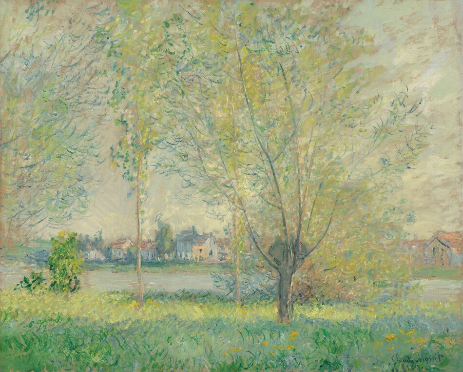 Between us and a river lined with buildings on the far bank in the distance, tall willow trees nearly span the height of this horizontal landscape. The scene is loosely painted, and the color palette is almost completely dominated by cool tones of spring, sage, celery, and kelly green, and steel and sea blue. The grasses near us are painted with diagonal strokes that alternate direction and color as they move back toward the river. Golden yellow daubs in the lower right suggest blooms, and leaves on the trees are created with thin, upward strokes and dabs along slender branches. The trees reach high into a sky filled with sweeps of beige, blush pink, and spring green layered over pale blue. The river is a lavender gray, and the low, tightly clustered buildings are painted with a mix of ochre, peach, and denim blue. The artist has signed and dated the work in the lower right corner, though the final digit is illegible: “Claude Monet 188.”