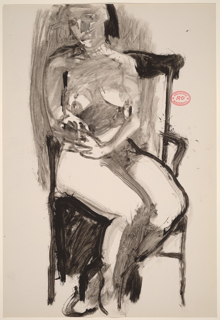 Untitled [seated female nude in high back armchair]