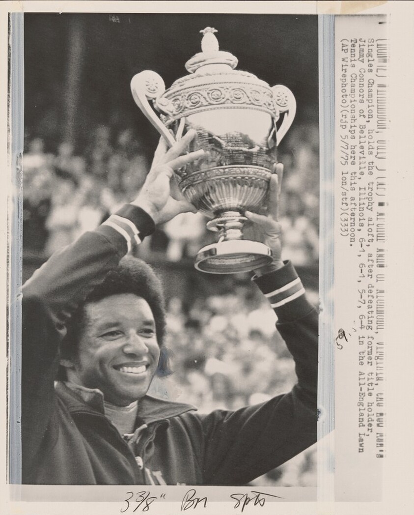 Title from caption on object: “Triumphant Arthur Ashe at Wimbledon”