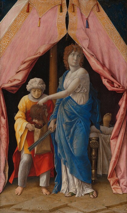 Standing at the entrance of an open tent, a woman holds the severed head of a bearded man over a sack held open by another person in this vertical painting. All the people have pale, ivory-white skin. To our right, Judith, who holds the head, stands with her body angled to our left. She looks back over her shoulder, off to our right, with light brown eyes. She has a long nose, smooth cheeks, and her small, peach-tinged lips are closed. Tightly curled, amber-brown ringlets frame her oval face and fall to her shoulders. Her loose, pearl-white dress, which is almost the color of her skin, falls off one shoulder and is belted just below her bust. A long, ultramarine-blue cloth drapes over one shoulder and arm, and around her body. Open-toed, moss-green sandals peek out from beneath her hem. Her right hand, to our left, grasps a long, straight, iron blade by her hip. The blade has a ridge up along its center, and the tip is cut straight across. She holds up the severed head in her other hand, so that arm crosses her body. The severed head faces away from us so only a sliver of the nose, cheek, and one closed eye are visible. The head has chestnut-brown hair and beard, and the mouth is open wide. To our left, the attendant holding the sack looks down at the head, her face framed by a white cloth that wraps around her head, under her chin, and across her shoulders. She wears a canary-yellow tunic over silvery-gray pants. A red cape drapes over one shoulder and around her body. She is barefoot. The tent is supported by a wooden pole, just beyond and between the pair. The gold-edged, rose-pink flaps of the tent have been pulled back and tied to each side. The interior beyond them is dark but the end of a gold bed draped with white cloth and one bare foot, the sole coming toward us, emerges from the shadows, to our right of Judith. The ground beneath the tent is made of tan, roughly square stones, scattered with pebbles. The peak of the tent rises off the top center of the composition, and the area to each side is midnight blue.