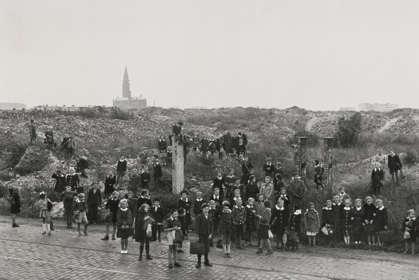 School children walking home through the ruins of the Warsaw ghetto, Poland