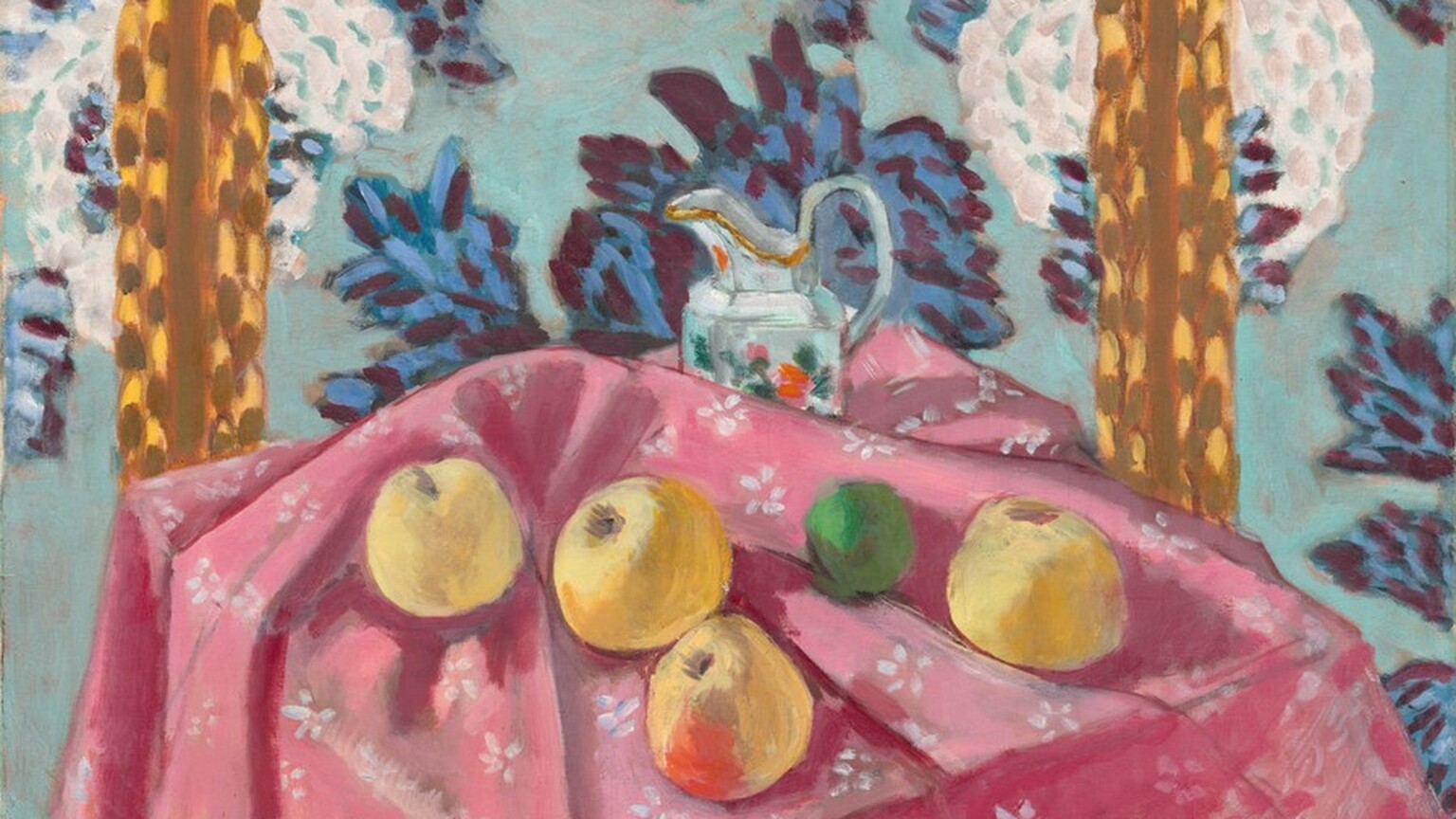 Four yellow apples, a lime, and a ceramic pitcher are loosely arranged across a tabletop covered with a carnation-pink cloth patterned with white flowers in this almost square, stylized still life painting. The scene is loosely painted with visible brushstrokes in saturated colors throughout. We look slightly down onto the front corner of the table, where the canary-yellow apples sit in the folds of the tablecloth. The apple closest to us at the corner of the table has a scarlet-red patch on the side facing us. Between the two rightmost apples, the lime is painted in shamrock and fern green. The cloth is bunched up just behind the apples to partially obscure the pitcher sitting near the back of the table. The pitcher is painted with swipes and patches of white, aquamarine blue, and silver gray with gold highlights along its spout. Daubs of pine green, rose pink, and flame red suggest a floral decoration on its side. The wall beyond the table fills the height of the composition, and is scattered with white flowers layered over an aquamarine-blue background. The blossoms seem oversized, each the size of a blown-up balloon. Other leafy forms painted with sapphire blue and plum purple could be more flowers or leaves. Two vertical stripes to the left and right behind the table are made up of strokes and daubs of caramel brown over honey yellow. The artist signed the lower right, “Henri-Matisse.”