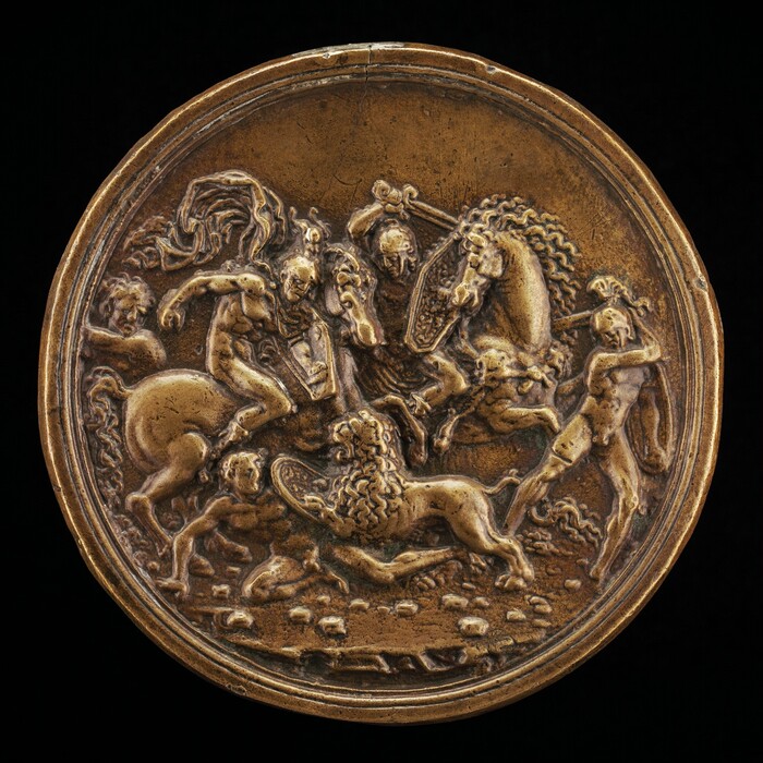 The sculpture is a roundel featuring a dynamic relief scene depicting multiple figures in what seems like a battle or a hunt. The central figures consist of a bare-chested human and another on horseback, both engaged in combat. A lion is prominently displayed amidst the chaos, interacting with the figures. All are positioned tightly within the circular boundary of the sculpture. The sculpture is cast in a golden-hued metal, likely bronze. The figures are intricately detailed, conveying a sense of movement and tension. The size and detail suggest that the sculpture is a delicate work meant to be viewed up close.
