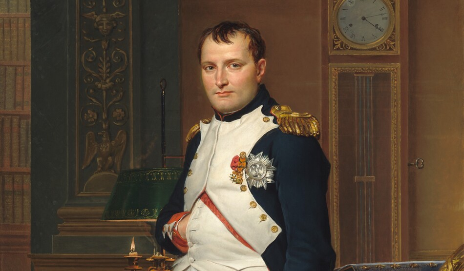 A man with pale peach skin and dark hair wears a military uniform and stands in front of a desk in this vertical portrait painting. He nearly fills the composition so seems close to us, and he looks directly at us. His body is angled slightly to our left and he tucks his right hand, on our left, flat against his chest between the buttons of his jacket. His navy-blue waistcoat is white along the front where it is fastened with brass buttons along his chest. The jacket has red cuffs, gold epaulets on the shoulders, and three medals affixed to the chest. White britches end just below the knee, and white stockings covering his calves are wrinkled at the ankle above black shoes with brass buckles. A candle burns low in a lamp on an ornately carved and gilded desk behind the man. Books and papers are piled on the desk to our right. More papers and a thin sword rest on a chair in front of the desk to our right. The chair is also carved and gilded, and is upholstered with scarlet-red fabric decorated with gold bees. The legs of the chair push back the forest-green carpet underfoot. A tall clock stands on the wall opposite us and reads 4:13. A few capital letters are written on a scroll of paper on the chair, “COD.” The artist’s name is also written as if printed on a scroll of paper on the floor behind the desk to our left: “LVD.CI.DAVID OPVS 1812.”