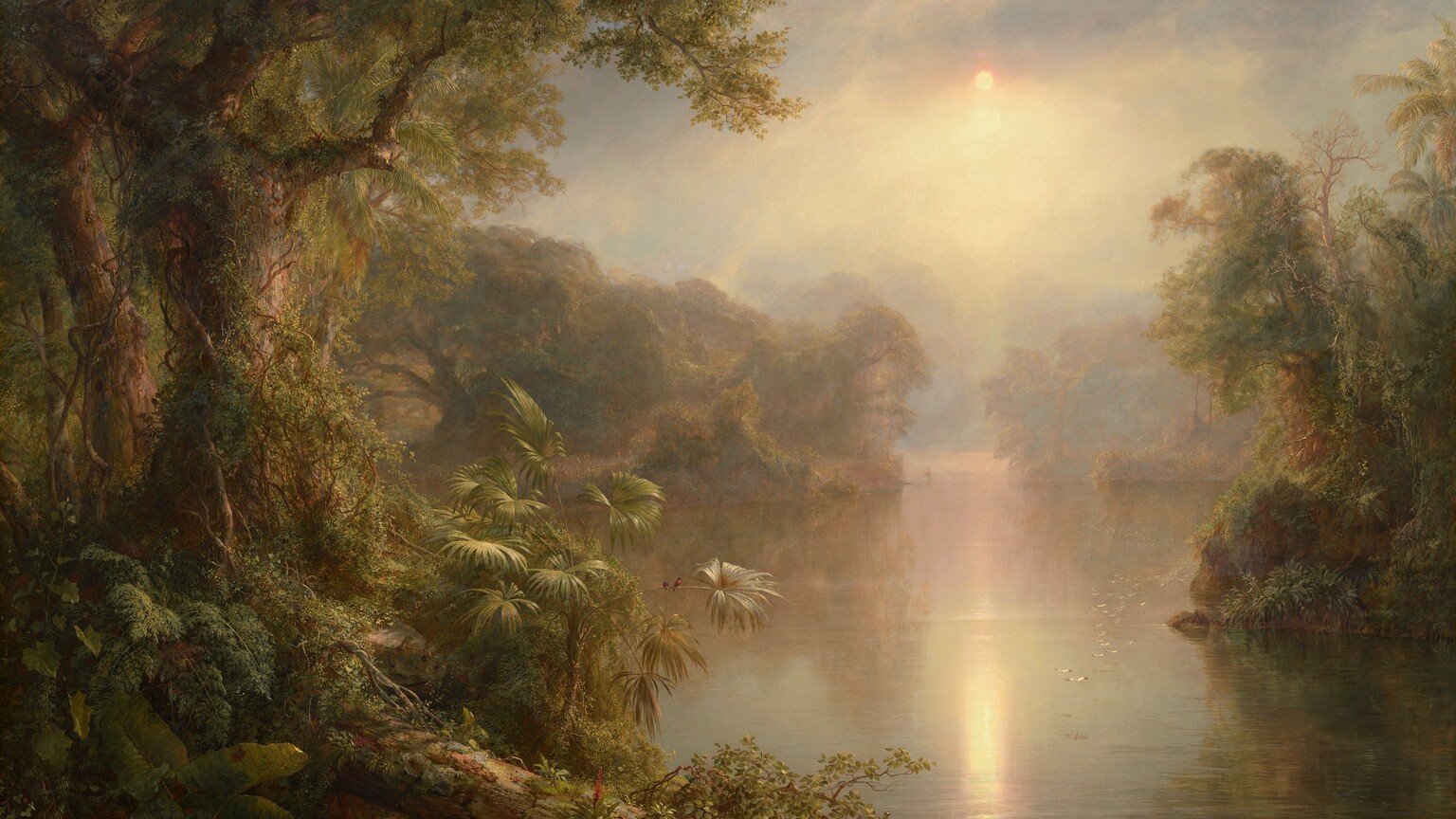 We look through a tropical forest lining a hazy, wide, placid river in this horizontal landscape painting. Densely packed trees, bushes, and plants create shadowed, thickly forested banks along both sides of the river. The trees are covered with climbing vines, and they have gnarled, sprawling branches. Light catches the flat leaves of a palm-like plant close to us to our left, and once we take a closer look, we find two minuscule black birds with cherry-red chests perched on a long curving stem. The vegetation is reflected in the water’s surface into the distance, where it becomes pale mauve-pink and blends imperceptibly with the sky and clouds. A flock of white birds create a long line low over the water to our right. The sun is a small disk of white low in the humid sky amid pale lavender-purple clouds. The sun reflects in the calm surface of the water below, and it brings our attention to a person rowing a canoe, barely visible on the river in the deep, misty distance.