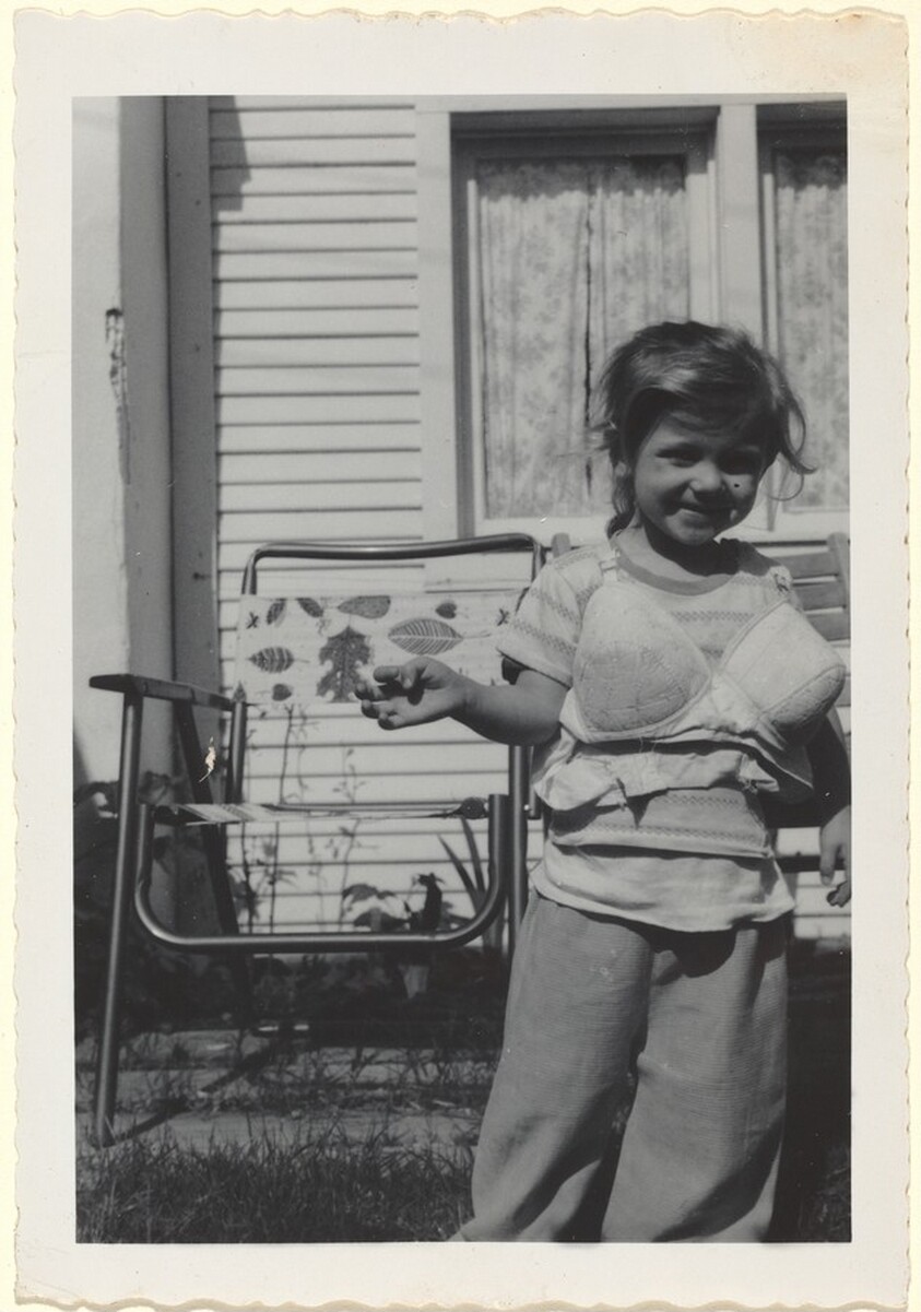 Untitled (Little girl dressing up in bra)