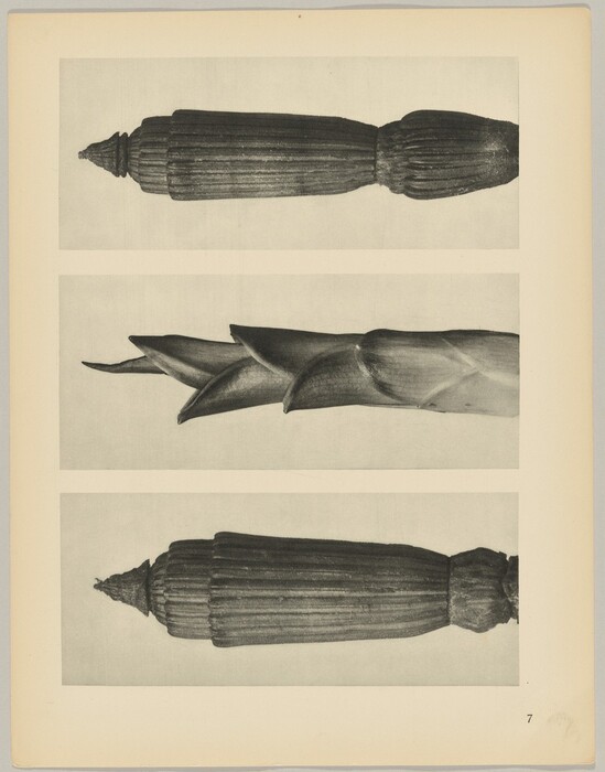 This is a photograph of three wooden architectural elements or carvings. The image is presented in black and white and shows three distinct components laid out horizontally in three rows. The top and bottom elements feature fluted, cylindrical designs with cone-shaped terminations. The middle element has a twisting, unfolding structure resembling a plant or flower bud. The photograph captures the texture and craftsmanship of the wood, showcasing intricate patterns and smooth surfaces.