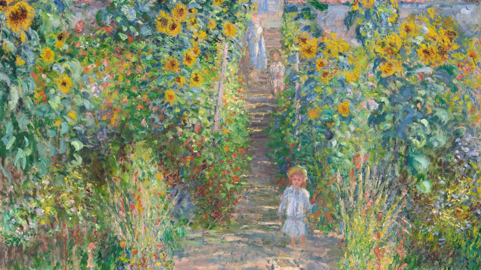 A small child stands facing us on a sun-dappled path that runs up the center of a garden dominated by towering yellow and burnt-orange sunflowers in this loosely painted, vertical scene. The light comes from our right so long, sea-green and plum-purple shadows cross the peach-colored path. The path is wide at the bottom center of the canvas and narrows as it reaches the steps of a house, beyond the garden. Close to us, four blue and white porcelain urns line the path, separating it from the grassy banks to either side. The urns are filled with tall stems with coral-pink and cardinal-red flowers. The child stands about halfway back along the path, where the garden transitions from grass to the banks of tall sunflowers. A few strokes in front of the child could be a small dog. Behind the child, a woman and another child stand on the steps. The woman wears a cornflower-blue and white dress, while both children have bare legs and wear white clothes and yellow hats. All three have indistinct facial features and peach-colored skin. The house spans with width of the composition. It has an amethyst-purple roofline with two chimneys, and the petal-pink walls have mango-yellow highlights. Windows are covered with blue latticework. Above the house, fluffy white clouds float against a vibrant blue sky. The artist signed and dated the painting at the lower right in dark blue, “Claude Monet 80.”