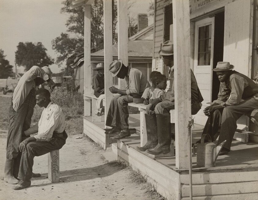 Haircut in Front of General Store and Post Office on Marcella Plantation, Mileston, Mississippi