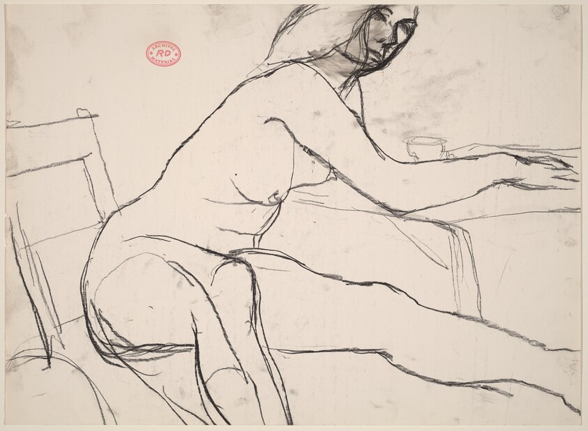 Untitled [seated female nude leaning on table]