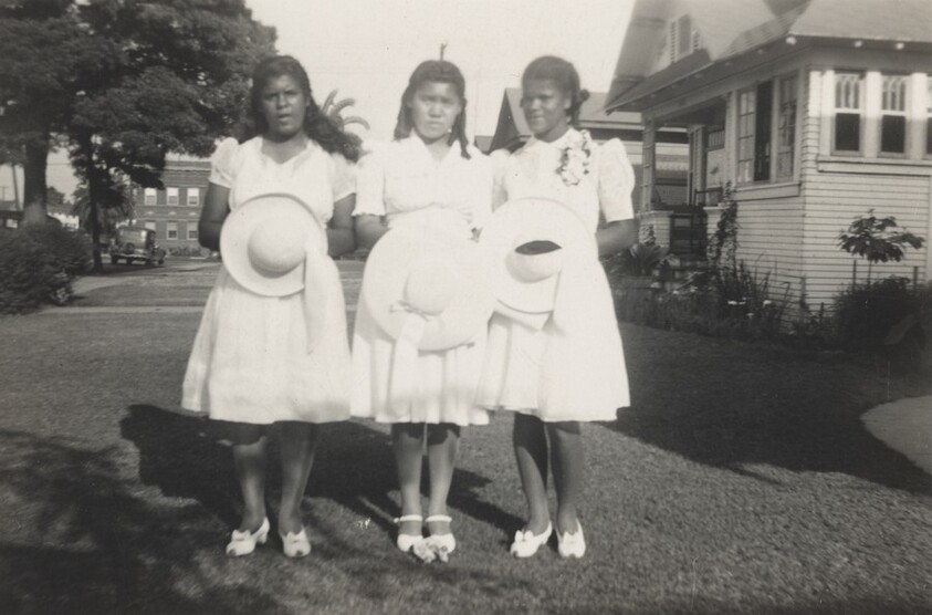 Untitled (Three young women holding hats)
