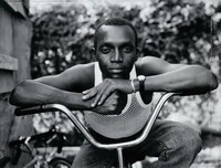 Young Man Resting His Arms on Bicycle, Amityville, New York, Dawoud Bey, 1988, printed 2021