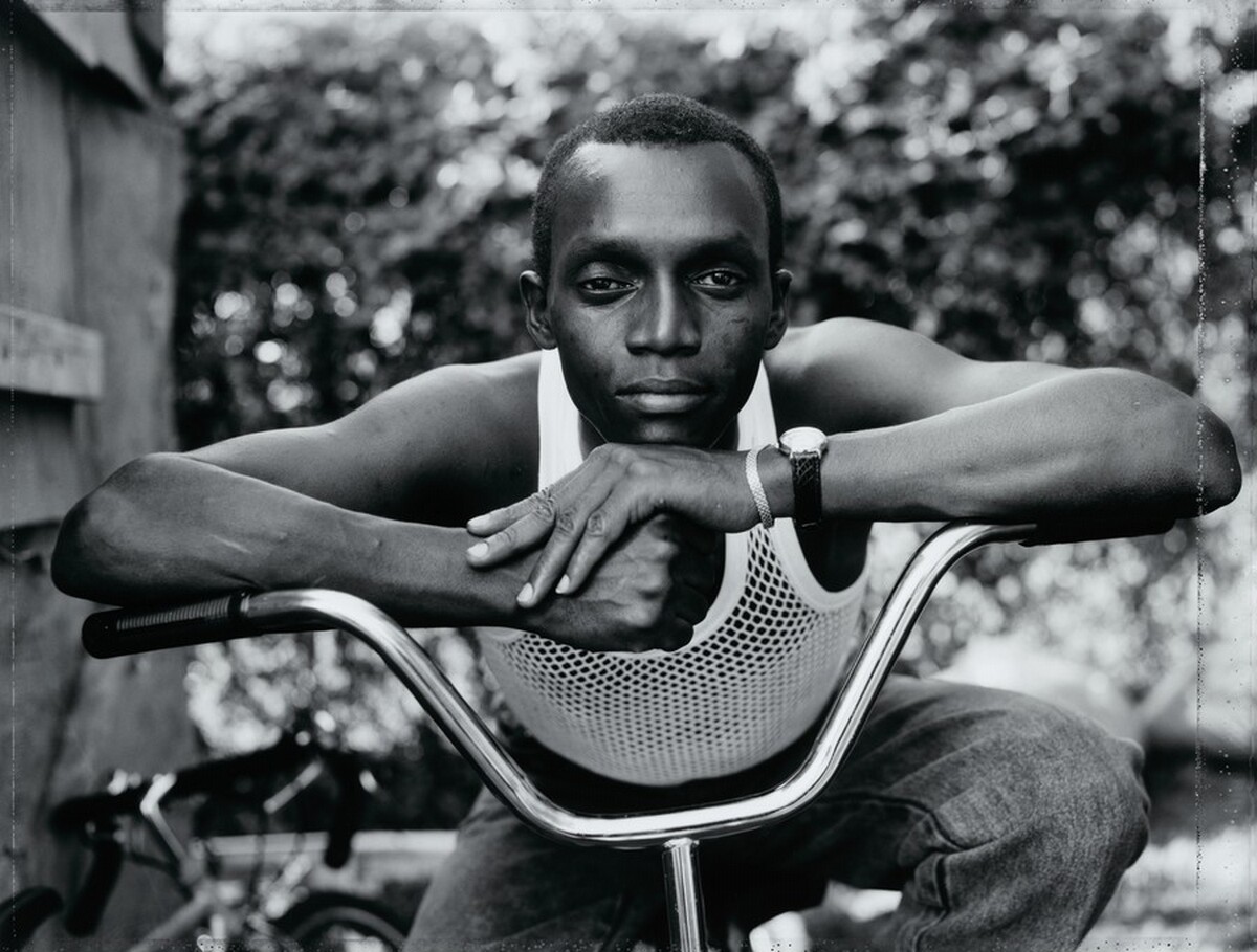 Young Man Resting His Arms on Bicycle, Amityville, New York