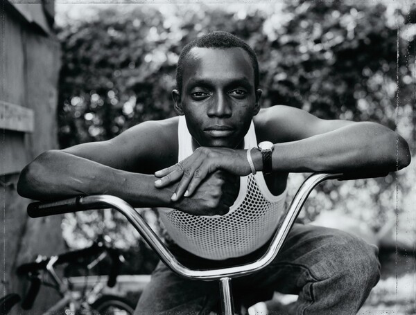 Young Man Resting His Arms on Bicycle, Amityville, New York
