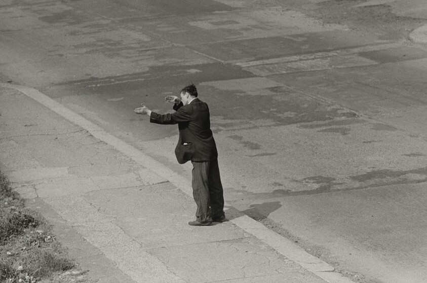 Man Gesturing in the Street