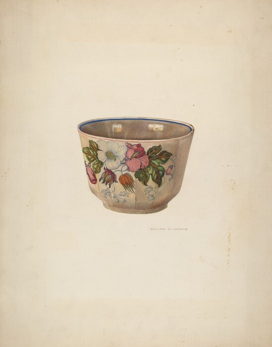 The image shows a ceramic cup with a floral pattern of pink and white flowers and green leaves. The cup is decorated with a muted color palette of beige, pink, white, and green. It is placed centrally on a plain background, slightly tilted to show the floral design around it.