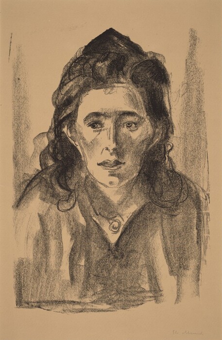 The image displays a portrait of a person from the chest up. They are staring directly at the viewer, with a distinct facial structure, including prominent cheekbones and deep-set eyes. The person has medium-length, wavy hair and is wearing a garment with a high collar and a circular design at the neckline. The background is plain, emphasizing the subject in the center. The portrait is done in a monochromatic style with high contrast.