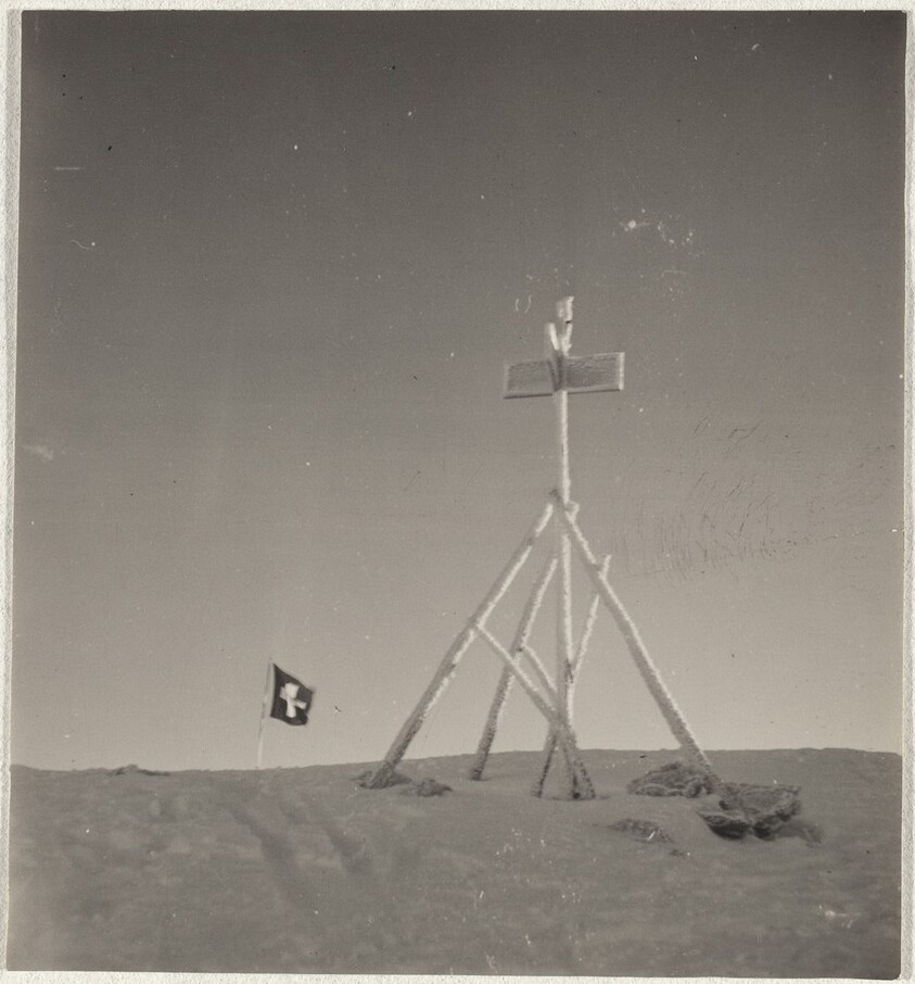 Swiss flag on mountain peak, Arosa