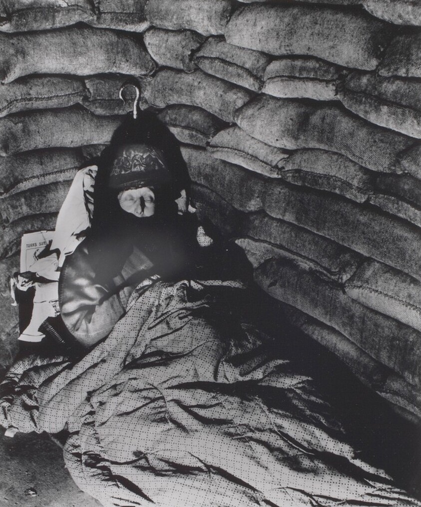 Old lady in a Pimlico air-raid shelter, her silver-handled umbrella safely tucked away behind her