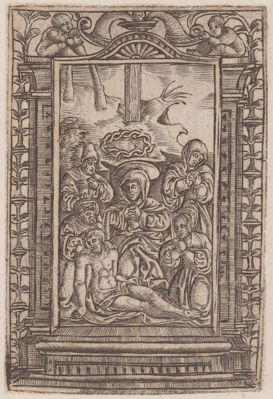 This is a drawing of a religious scene in an elaborate frame. The central image contains a group of figures engaged in a religious activity, with a horizontal figure at the bottom surrounded by other figures in robes. Above them, a burst of light radiates from behind a skull encircled by a crown of thorns. The frame is adorned with intricate motifs and carvings, including foliage designs along the sides and cherubic figures in the corners.