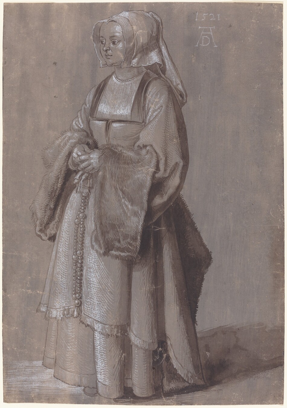 A woman stands angled to and looking off to the left in this vertical, full-length drawing, which was created with brown and white ink and shaded with washes of the same color on smoky purple-colored paper. The woman has a heart-shaped face with a short, rounded nose, full lips, and a bulb-shaped chin. Her head is covered with a white cloth that drapes to chin length at the sides and falls down her back. The square neckline of her bodice is low, but her chest is covered with a white cloth. The voluminous sleeves are lined with wide, long bands of fur along the cuffs, and she holds her hands clasped in front of her waist. A beaded rosary hangs from her waist, and the deep folds of her heavy skirts fall almost to the floor. The artist signed the drawing near the upper right corner with a capital letter D tucked between the long legs of a letter A. The monogram is below the date, 1521.