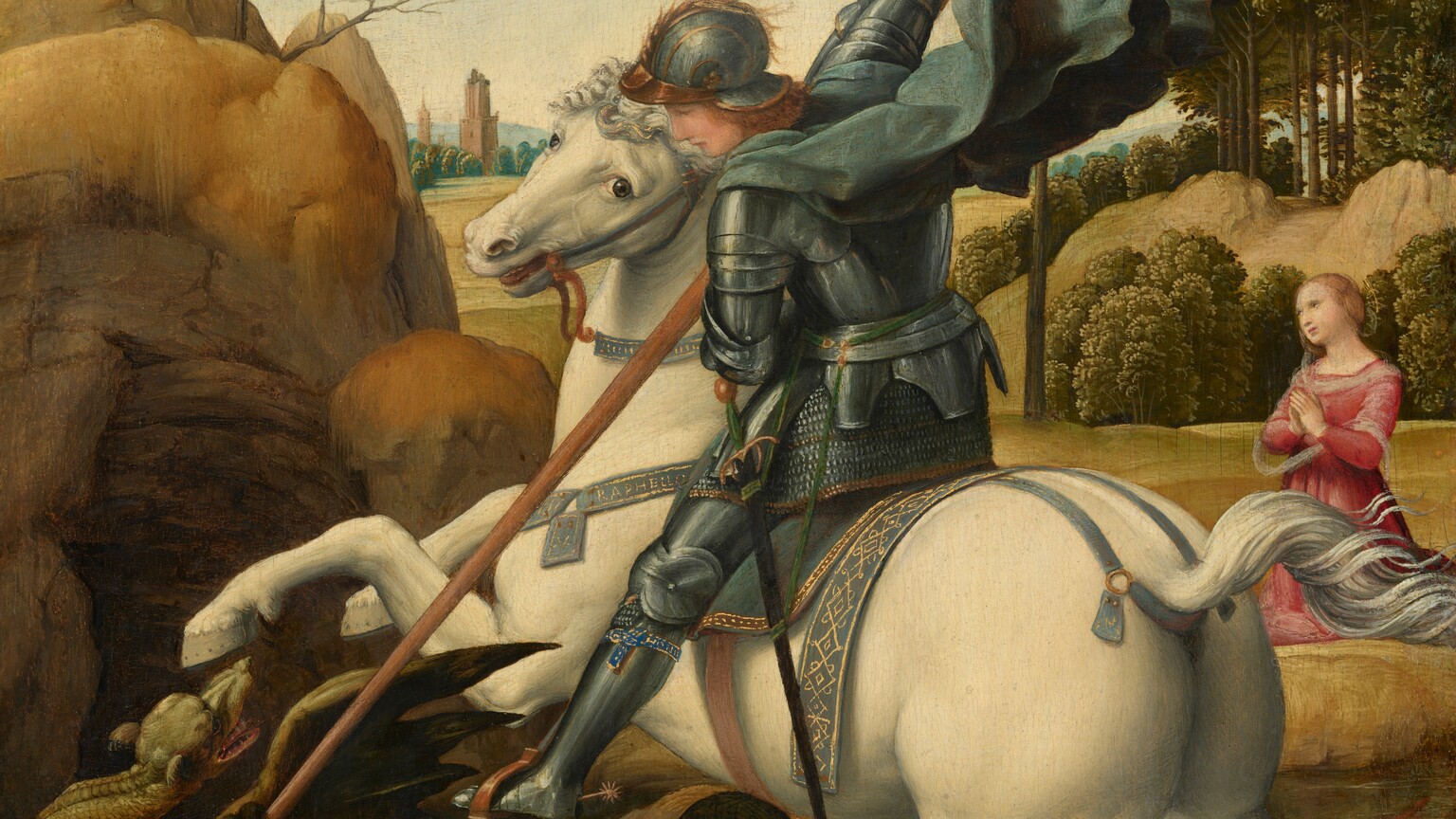 A man wearing armor, sitting astride a cream-white horse, drives a long lance down at a lizard-like dragon as a woman kneels with her hands in prayer in the landscape beyond in this vertical painting. Both people have pale skin and thin, gold halos floating above their heads. At the center of the composition, the man faces our left in profile as he looks down at the creature. The man has a straight nose and honey-brown hair under his gold-trimmed, pewter-gray helmet. Armor covers his entire body, and a celestial-blue cape billows behind him from where it fastens around his neck. A narrow, indigo-blue and gold band is tied around his left calf, and is inscribed with the word “HONI.” A black sword hangs from his left side. The horse is white with a silvery-white mane and tail. It rears on its hind legs as it turns its head to look at us with hazel-brown eyes. The horse wears a blue saddle and bridle, the same color as the man’s cape, trimmed with gold. A strap around the horse’s neck is painted in gold with the name, “RAPHELLO.” The rider thrusts his foot into the stirrup we can see as he plunges a lance down at the dragon under the horse’s front feet. The dragon has tawny brown skin with a mint green, dog-like head. It grips the earth with clawed feet as at pushes at the lance with one front foot. It twists its long, snake-like neck to look at the man with dark eyes. The dragon opens its pointed snout to show its teeth, and bat-like wings splay out. A tall outcropping over a cave rises along the left edge of the composition, behind the dragon. In a field a little farther back, to our right, the woman kneels with her body angled to our left. She tilts her head away from us and gazes past the man and horse. She has a straight nose, pale pink, bow-shaped lips, and her blond hair is pulled back in a bun. She wears a ruby-red dress and a sheer white wrap around her shoulders and across her arms. Around the woman, straw-yellow hills with bands of pine-green trees roll into the distance. Two terracotta-orange towers rise from a row of trees along the horizon. A few taller trees are outlined against the baby-blue sky, which lightens toward the horizon.