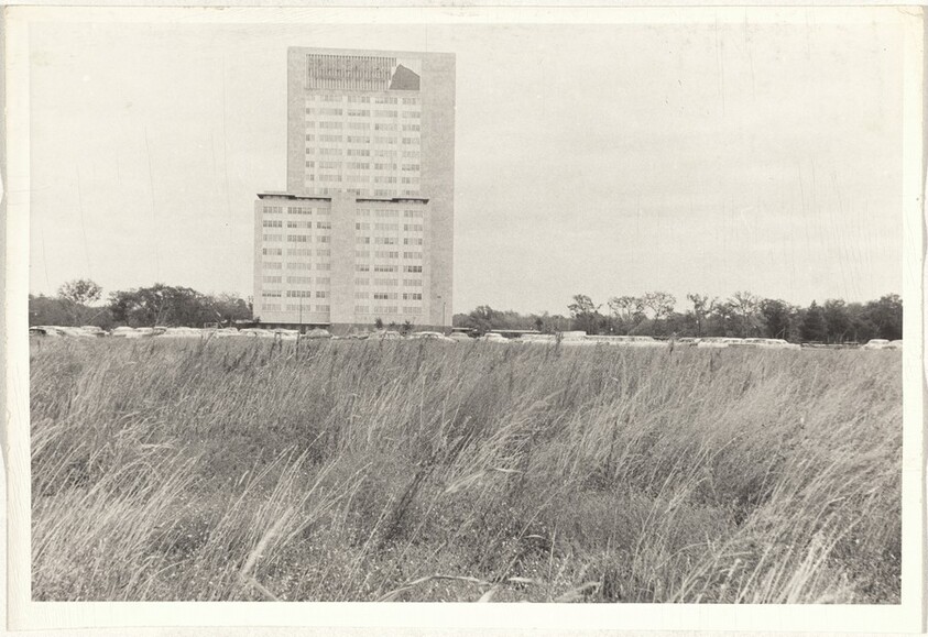 Building with field in foreground--Houston, Texas