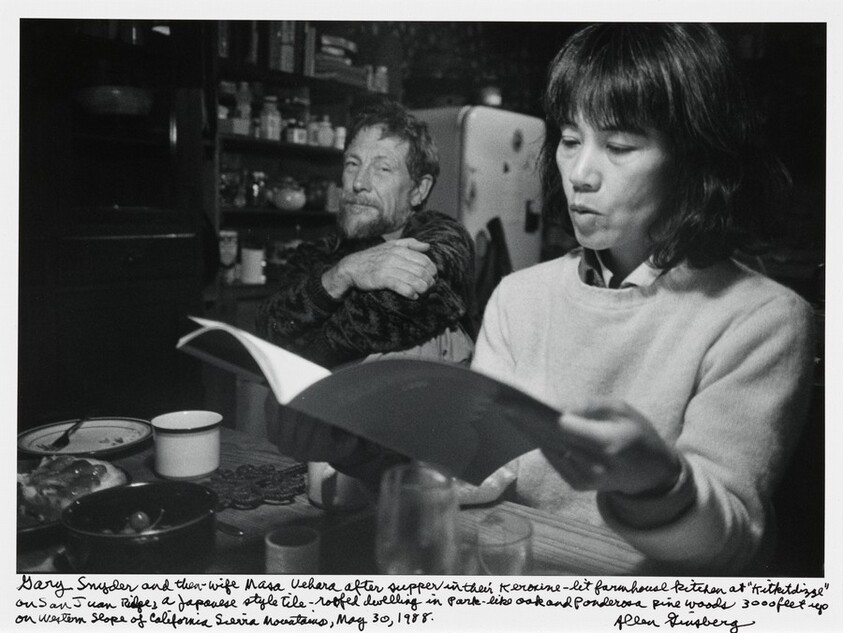 Gary Snyder and then-wife Masa Uehara after supper in the Kerosene-lit farmhouse kitchen at “Kitkitdizze” on San Juan Ridge, a Japanese style tile-roofed dwelling in park-like oak and Ponderosa pine woods 3000 feet up on Western slope of California Sierra Mountains, May 30, 1988.