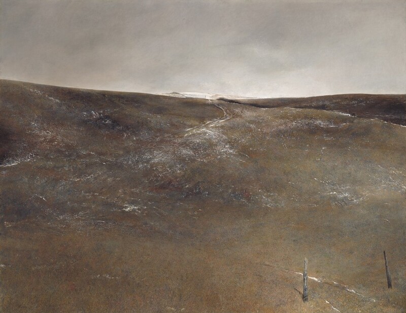 A hill slopes gently up and away from us, and is painted with a few streaks of white amid a field of earthy ash gray, fawn and rust brown, and muted olive green in this horizontal landscape painting. The horizon comes about two-thirds of the way up the composition, and the sky above lightens from smoky gray to our left to icy white to our right. Short, vertical brushstrokes along the bottom edge of the panel create the impression of scrubby ground cover. Between two splintered, worn posts near the lower right corner, snow has fallen in two lines that suggest former wagon tracks that quickly even out, though they reemerge, also lined with snow, near the crest of this low hill. More snow is sparsely scattered across the rise of the hill. A second hill, slightly darker in color, rises to our right. Even farther away, another hill is covered in snow. The artist signed the work in black paint in the lower left corner: “Andrew Wyeth.”