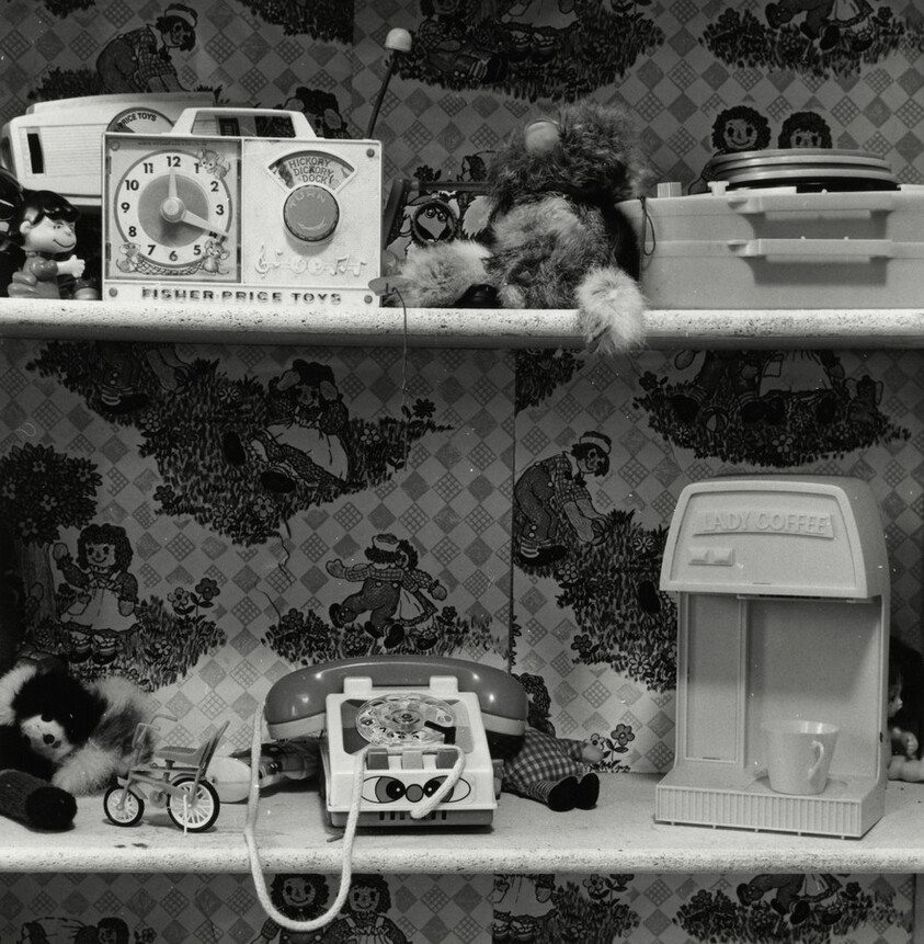 Two Shelves of Children’s Toy Appliances Including “Lady Coffee”–Raggedy Ann Wallpaper, Berkeley, California