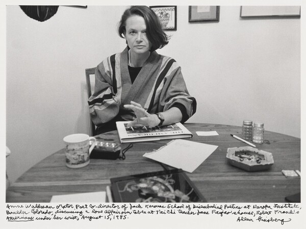Anne Waldman orator poet co-director of Jack Kerouac School of Disembodied Poetics at Naropa Institute, Boulder Colorado, discussing a love affair over table at T'ai Chi teacher Jane Faigao's house, Robert Frank's _The Americans_ under her wrist, August 15, 1985.