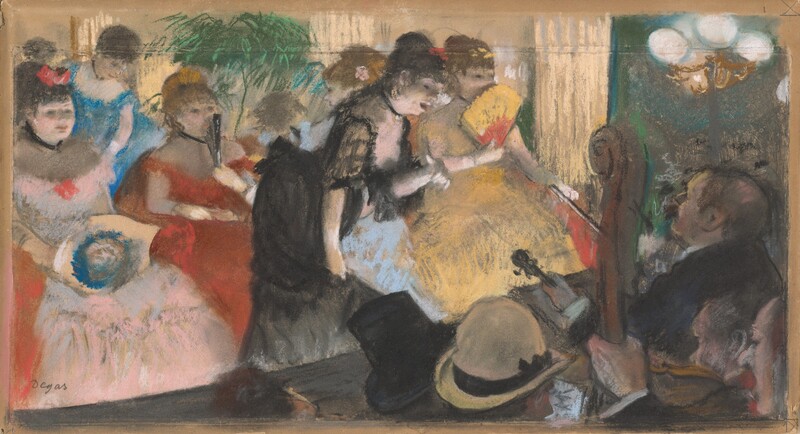 Six women wearing off-the-shoulder gowns with long skirts sit in front of a stage where several men play instruments in this horizontal pastel drawing. They all have pale skin and brown or black hair. Across the stage from us, the women’s gowns are petal pink, crimson red, butter yellow, baby or azure blue, or black, and they all wear black chokers around their necks. Their hair is swept up and tied with bows or ornaments to match their dresses. One woman holds a bouquet of flowers in her lap and two more hold fans, one open and one closed, to their mouths. Three women in the front row sit closely together and others turn or stand. The walls and possibly curtains of this space are luminous yellow, and a green palm-like tree is at the back of the room. The woman wearing black stands directly in front of the stage, one hand lifted and the other clasping her skirts as she leans toward the musicians. Her mouth is open, and she is harshly up-lit by the stage lights. Three men facing her hold a violin, upright bass, and perhaps a viola. Three more men closer to us face away so we only see the brown hair of one, the black top hat of another, and the straw-yellow bowler hat of the third. The stage space is enclosed opposite us with a wall streaked with kelly green, peacock blue, and charcoal gray. A three-lobed brass-colored light hangs or is affixed to the wall there. The artist signed the lower left, “Degas.”