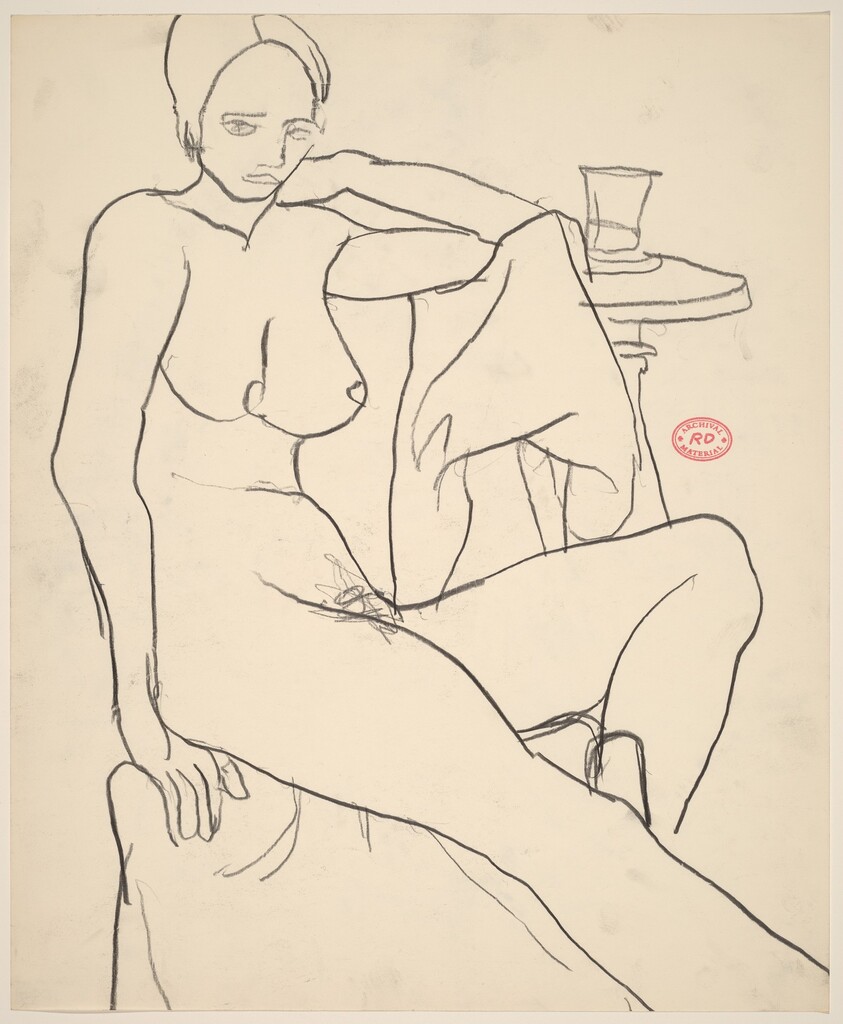 Untitled [female nude seated beside a table with a glass]