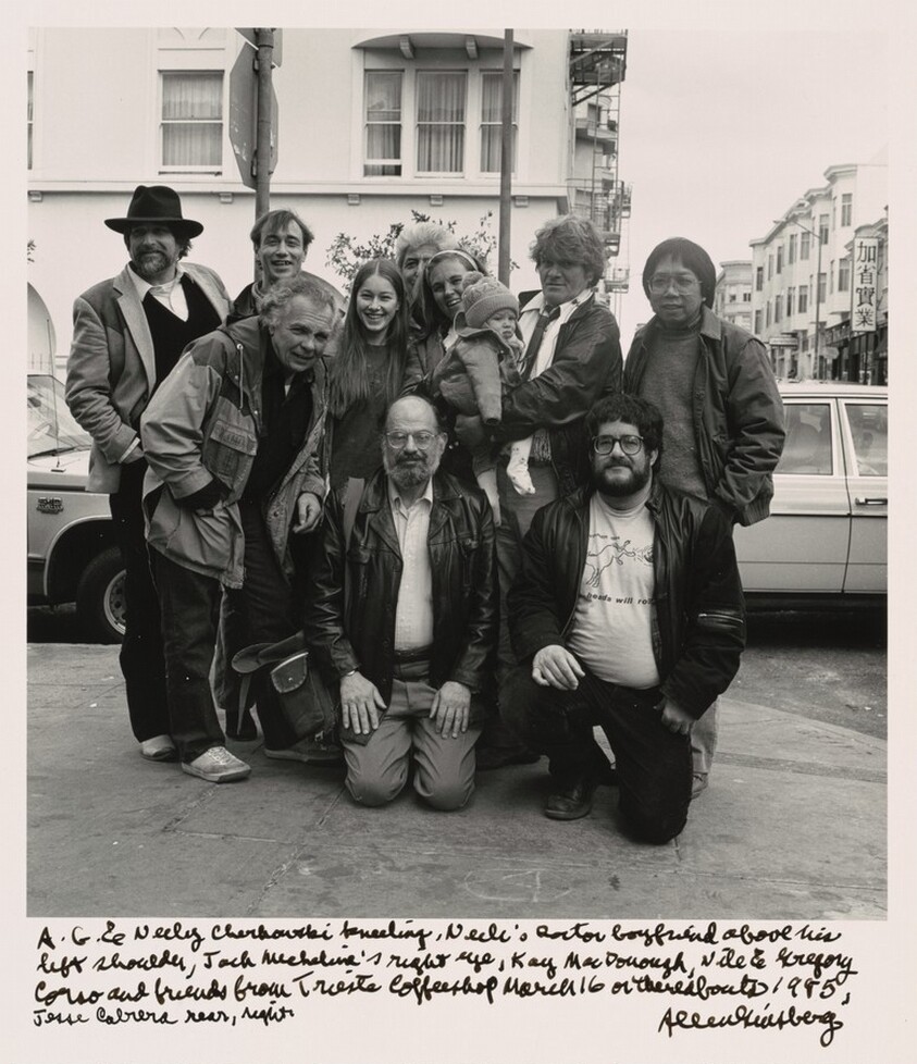A.G. & Neeli Cherkovski kneeling, Neeli's Doctor boyfriend above his left shoulder, Jack Micheline's right eye, Kaye McDonough, Nile & Gregory Corso and friends from Trieste Coffeeshop March 16 or thereabouts 1985, Jesse Cabrera rear right