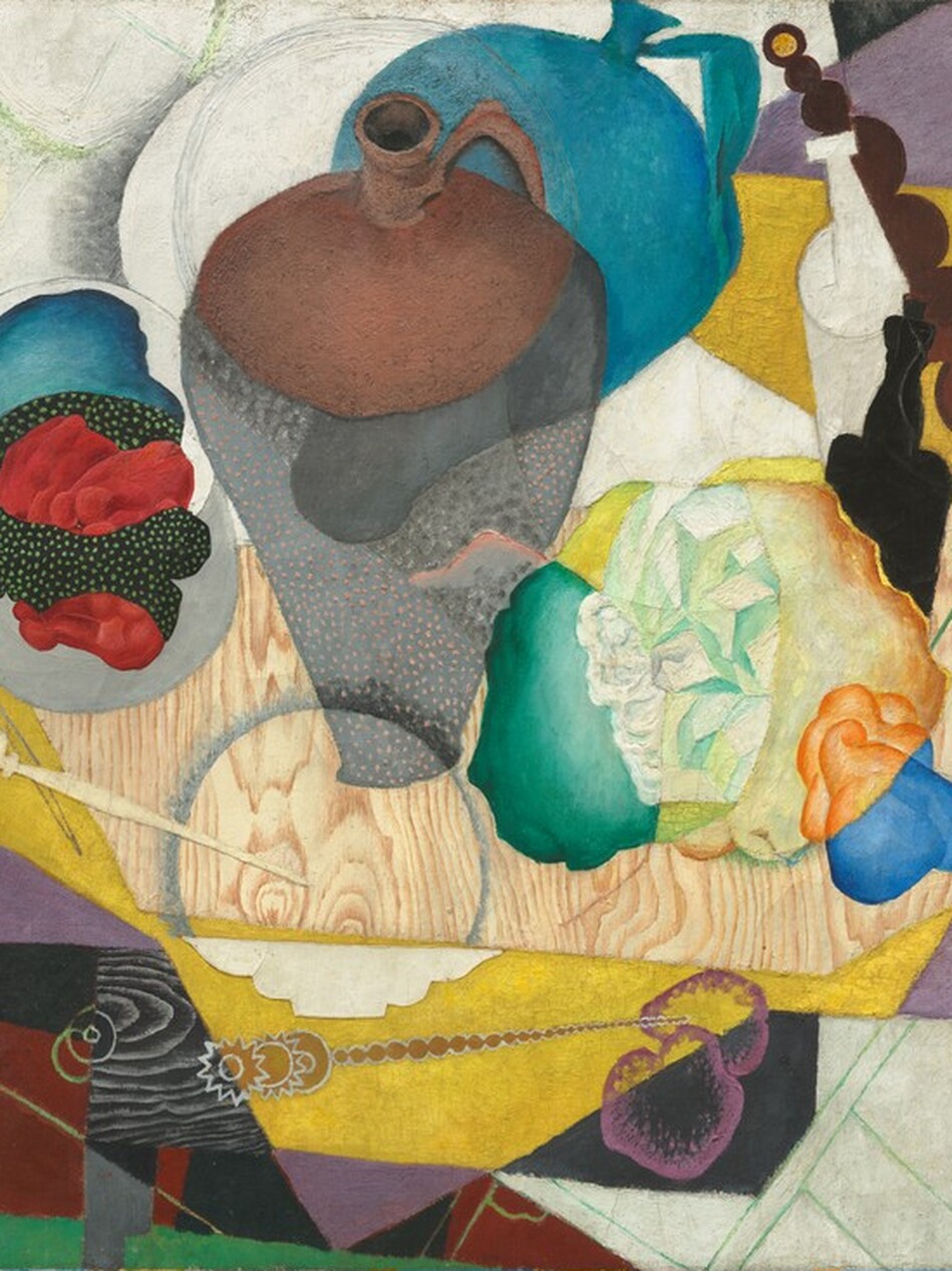 An abstracted jug, bottles, shapes reminiscent of balled up paper or fabric, and a needle-like letter opener are gathered on a wood square in this horizontal still life painting. Rectangles in shades of corn yellow, violet purple, burgundy red-and-black checks, white, black, and spruce green splay out behind the objects like untidily stacked placemats. The brown jug is at the center, and an echo of its form in teal blue presumably represents a shadow. Portions of the jug, wooden board, and crumpled material shift color and pattern as they intersect or overlap with other areas. The artist’s initials, “DMR,” are stenciled in yellow in the lower left corner.