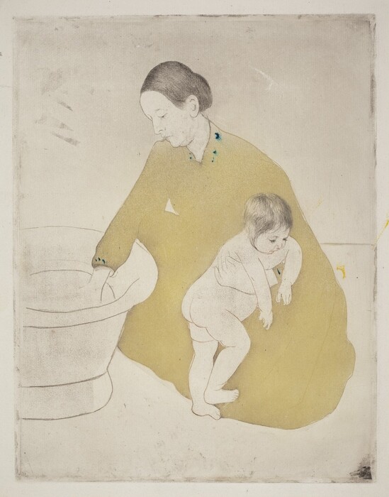 A woman kneels to test the water in a freestanding bathtub with one hand as she braces a nude child against her knee with the other in this vertical, colored print. The skin of both the woman and baby are the white of the paper. Their facial features and bodies are outlined with light brown, and their hair drawn in with faint black lines. The woman’s hair is pulled back from a high forehead, and she has a straight nose, pursed lips, and a slight double chin. Her long-sleeved, floor-length dress is a flat area of straw yellow. A few touches of teal blue near the neckline appear to have run into the surrounding ink. The baby turns toward the woman’s body and hangs their arms over her bracing hand. The baby has short, wispy, black hair with delicate facial features, a rotund belly, and satisfyingly pudgy rolls on the legs. The tub and the corner where the floor meets the wall are drawn in with brown lines. There are some smudges across the paper, especially at the edges.