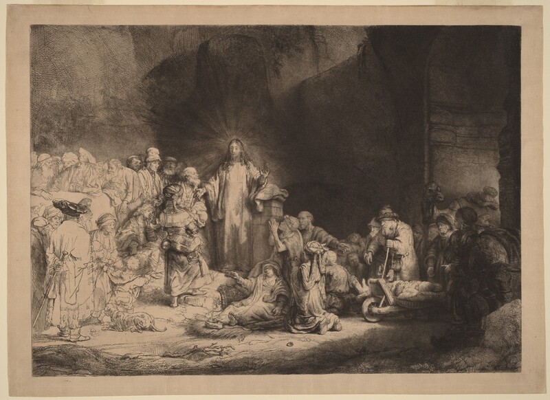 Printed with black lines and deep, velvety shading on tan-colored paper, a man, Jesus, stands at the center of a crowd of more than two dozen people, mostly adults and a few children, in this horizontal etching and drypoint. Jesus is left of center. He stands facing us, but he turns his head to look to our left. Rays of light emanate from behind his head against the towering cave opening that surrounds him. His curly hair falls long over his shoulders, and he holds both hands out. His eyes are lightly incised, giving them an almost blurred look. A crowd of people lie or kneel to our right. Some use crutches or walking sticks, and some are on carts. All the people appear to have pale skin except for one with darker-toned skin to the right in this gathering. That person has a rounded nose, full lips, and wears an earring that gleams brightly in the deep shadows. A camel stands at the far side of this group under an arched opening. The people standing and one person sitting close to Jesus to the left are fully shaded, and those farther left are lightly outlined and sparsely shaded so they appear to be much lighter on the white paper. Close to Jesus are a woman holding a baby, a seated, clean-shaven young man, and several bearded men. Most of those who are along the left edge of the sheet wear turbans or floppy caps.