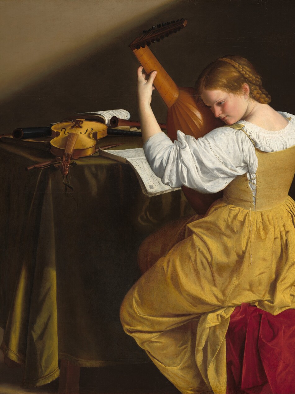 Facing away from us, a young woman with pale skin, wearing a golden yellow gown, leans her head down toward the lute she holds nearly upright in her lap in this horizontal painting. She sits near the right edge of the painting so her body faces the table beyond her, to our left. Her body is angled away from us but she turns her head so we see her in profile, facing our left. She tips her head to put her ear next to the lute, and she looks down and off to our left with brown eyes under thin, slightly arched brows. She has a straight nose, smooth, flushed cheeks, and her coral-pink lips are closed. Her dark blond hair is parted down the middle and pulled back under long braids looped around the back and over the top of her head. Light reflects off her hair and off the short, loose strands near the ear we can see. Her long yellow dress has a full skirt. The stiff bodice is laced up the sides and hooks over the shoulders, over a voluminous, bright white blouse. The sleeve we can see is pushed up over her forearm. Her seat is draped in crimson-red, velvety fabric. She holds the neck of the lute up high with her left hand, her fingers pressing the strings, so she brings the rounded body of the instrument up to her ear. In front of her, the table is draped with fringed, olive-green fabric. A violin made with blond wood lies on the table with the neck stretching toward us. There is also the violin bow and at least three wooden recorders on the table. One book of music is open so the pages fall over the edge of the table, near the woman. One other book of music at the back of the table is held open with a recorder. The feet of the table and the ankles of the woman are cut off by the bottom edge of the painting. The background is dark, earth brown except for a diagonal shaft of light across the top left corner of the composition, presumably from a high window in the wall out of our view.