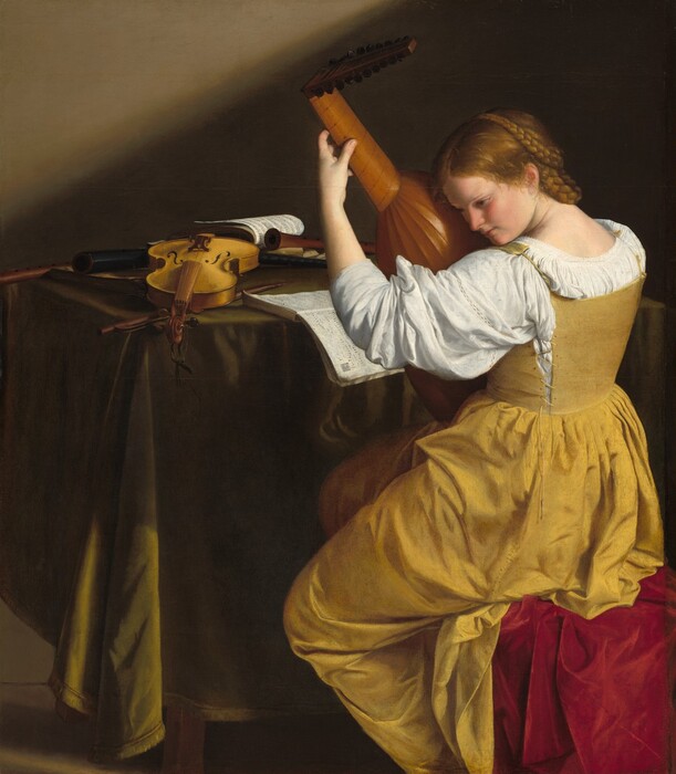 Facing away from us, a young woman with pale skin, wearing a golden yellow gown, leans her head down toward the lute she holds nearly upright in her lap in this horizontal painting. She sits near the right edge of the painting so her body faces the table beyond her, to our left. Her body is angled away from us but she turns her head so we see her in profile, facing our left. She tips her head to put her ear next to the lute, and she looks down and off to our left with brown eyes under thin, slightly arched brows. She has a straight nose, smooth, flushed cheeks, and her coral-pink lips are closed. Her dark blond hair is parted down the middle and pulled back under long braids looped around the back and over the top of her head. Light reflects off her hair and off the short, loose strands near the ear we can see. Her long yellow dress has a full skirt. The stiff bodice is laced up the sides and hooks over the shoulders, over a voluminous, bright white blouse. The sleeve we can see is pushed up over her forearm. Her seat is draped in crimson-red, velvety fabric. She holds the neck of the lute up high with her left hand, her fingers pressing the strings, so she brings the rounded body of the instrument up to her ear. In front of her, the table is draped with fringed, olive-green fabric. A violin made with blond wood lies on the table with the neck stretching toward us. There is also the violin bow and at least three wooden recorders on the table. One book of music is open so the pages fall over the edge of the table, near the woman. One other book of music at the back of the table is held open with a recorder. The feet of the table and the ankles of the woman are cut off by the bottom edge of the painting. The background is dark, earth brown except for a diagonal shaft of light across the top left corner of the composition, presumably from a high window in the wall out of our view.