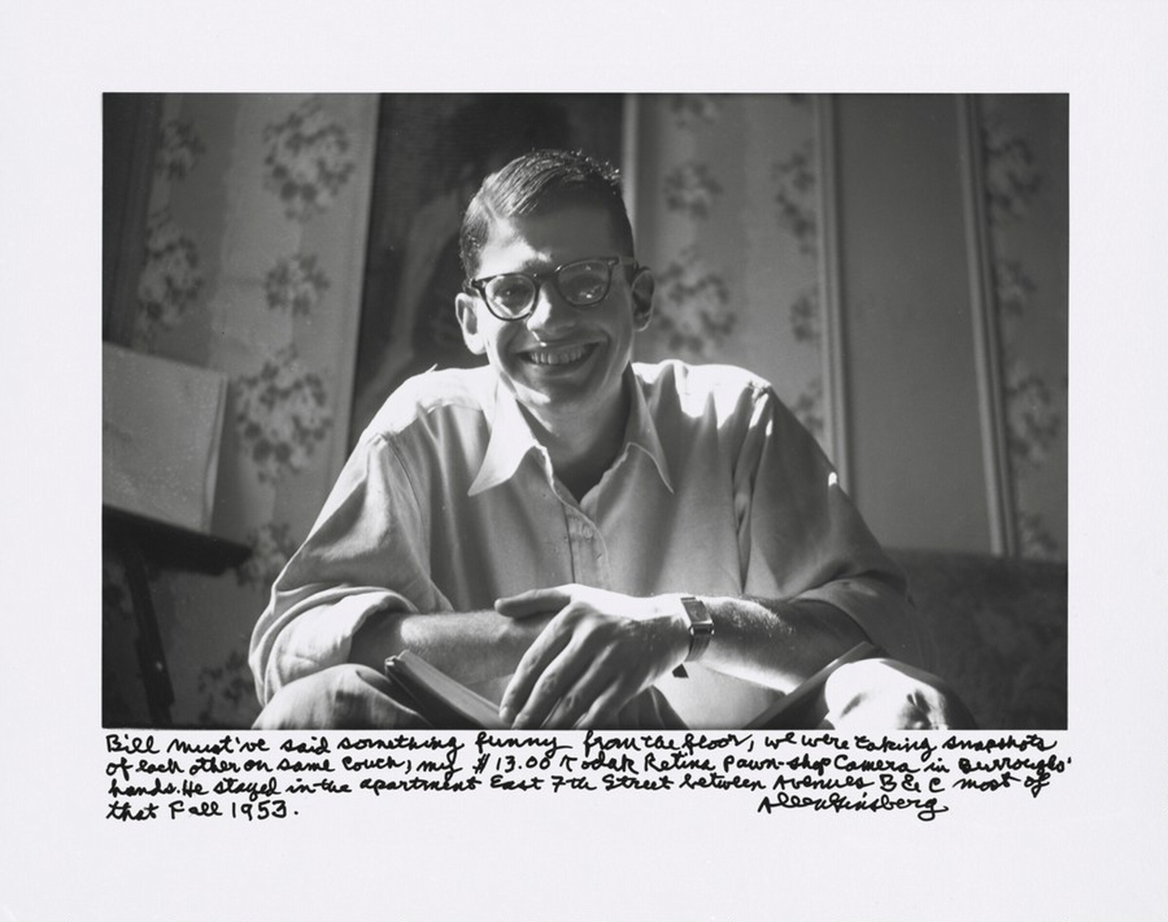 Bill must've said something funny from the floor, we were taking snapshots of each other on same couch, my $13.00 Kodak Retina pawn-shop camera in Burroughs' hands. He stayed in the apartment East 7th Street between Avenues B & C most of that Fall 1953., Allen Ginsberg, 1953, printed later