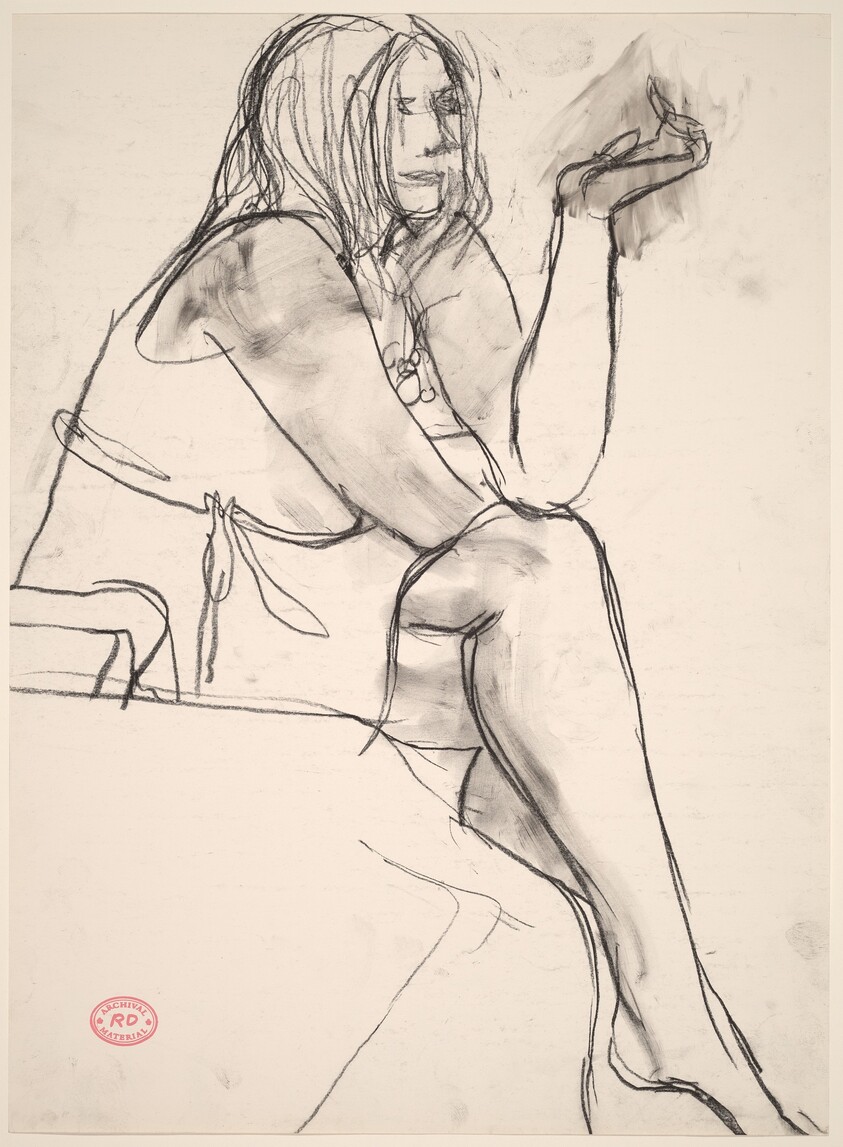 Untitled [seated woman with crossed legs]