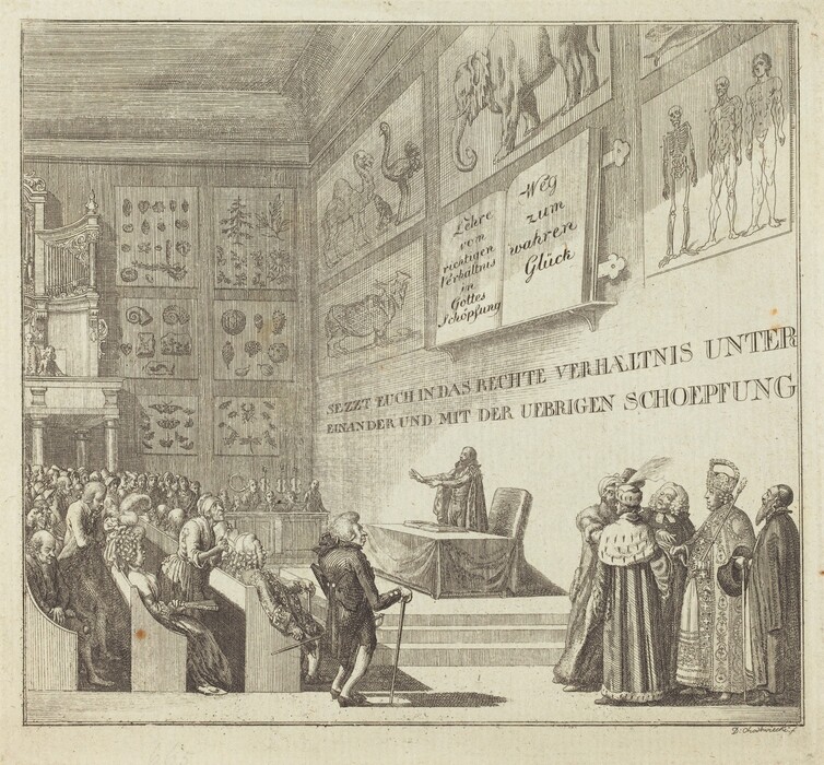 This is a drawing of a lecture or presentation in an academic setting. The scene includes an interior space similar to a lecture hall with detailed illustrations on the walls showing various scientific and anatomical drawings. In the center, a figure stands at a podium gesturing towards the audience, while others in elaborate attire stand to the side. The attendees are seated in rows, facing the speaker. Above the speaker are large posters with German text and scientific illustrations. The artwork emphasizes the scientific and scholarly atmosphere, highlighting a focus on enlightenment and learning.