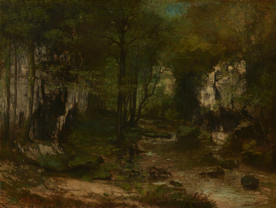Dense canopies enclose a forested interior along a stream in this horizontal landscape painting. Only a couple small patches of ultramarine-blue sky peek through the canopies, which are painted with dabs and strokes of pine, olive, and spring green. Dark trunks stand straight or curve up through the foliage. The stream begins in the lower right corner of the canvas and moves into the distance along the right half of the composition. Rippling water is painted with shades of muted green, ice blue, and very pale pink. Grassy patches line the dirt ground to the left. The artist signed and dated the painting in the lower left corner, “G. Courbet ’55.”